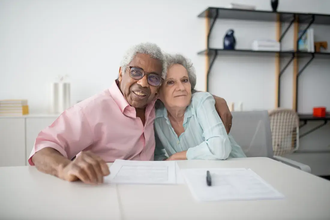 An older couple at home reviewing their estate planning documents